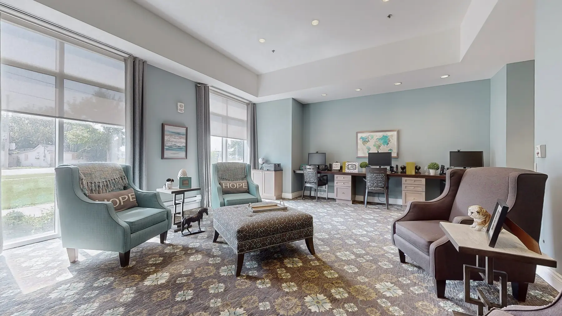 Lounge with chairs at Chartwell Stoney Creeek