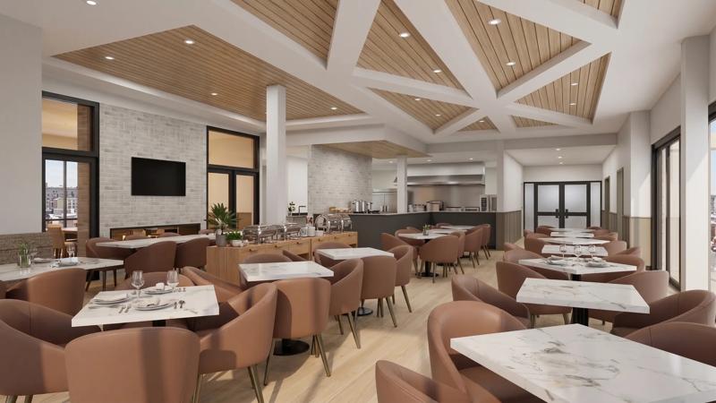 Chartwell Kingsview common dining room with multiple square tables and comfortable chairs