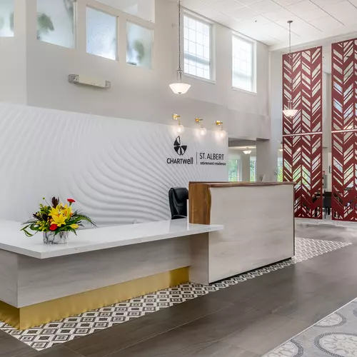 welcoming lobby and reception desk at chartwell st albert retirement residence