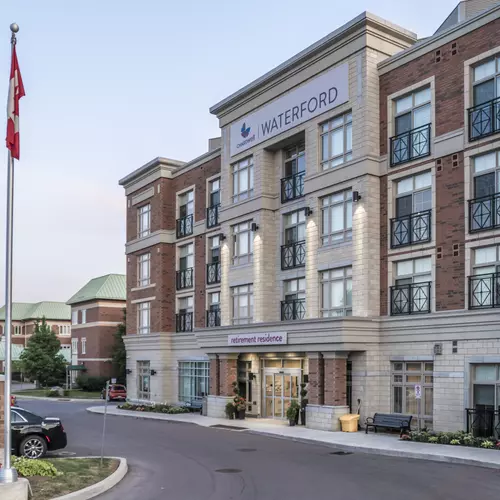 Building with Canadian flags at Chartwell Waterford Retirement Residence